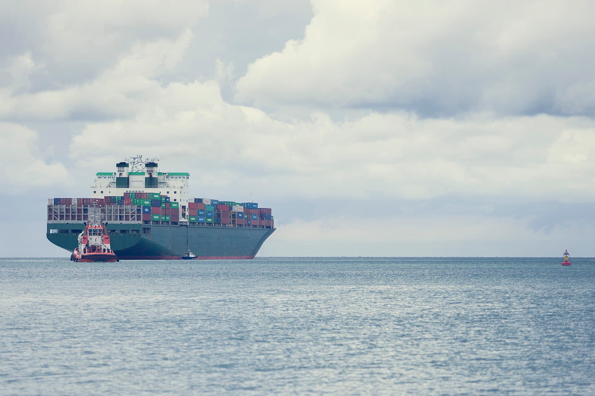 Loaded container ship arriving at port