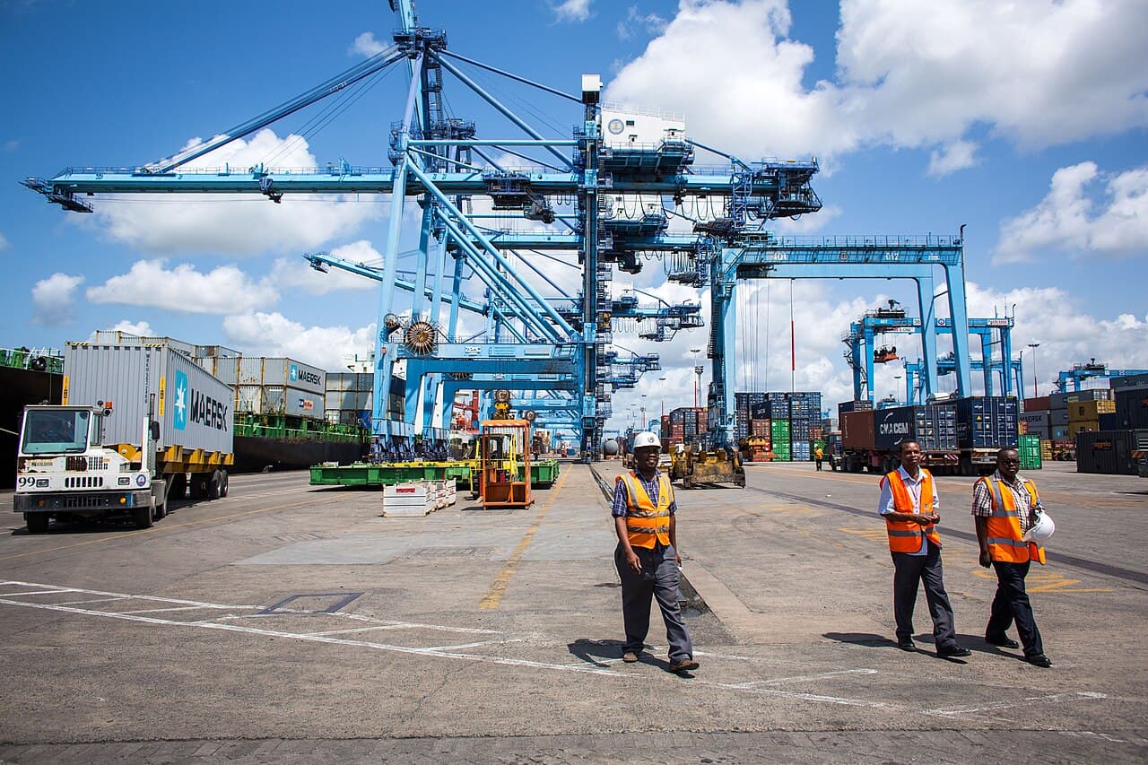 Port staff beside ship-to-shore cranes, Mombasa